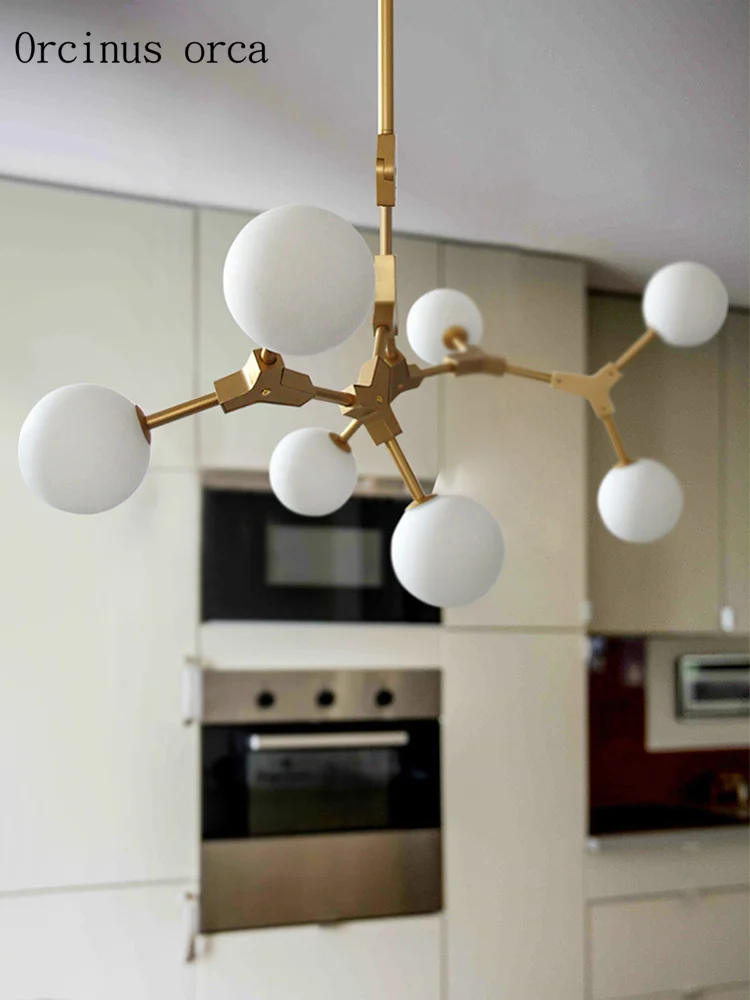 Postmodern creative personality magic bean chandelier restaurant bedroom Nordic simplified LED golden glass ball Chandelier
Postmodern creative personality magic bean chandelier restaurant bedroom Nordic simplified LED golden glass ball Chandelier