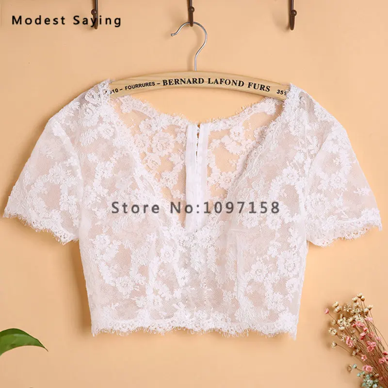 Elegant Ivory V Neck Short Sleeves Lace Wedding Boleros 2018 Buttons Back Women Bridal Capes Jackets Shawls Wedding Accessories
Elegant Ivory V Neck Short Sleeves Lace Wedding Boleros 2018 Buttons Back Women Bridal Capes Jackets Shawls Wedding Accessories