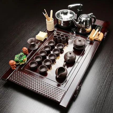 Household Tea Set Purple Sand Kung Fu Solid Wood Tea Tray Set Teapot Teacup four in one induction cooker Tea table Tea Ceremony
Household Tea Set Purple Sand Kung Fu Solid Wood Tea Tray Set Teapot Teacup four in one induction cooker Tea table Tea Ceremony