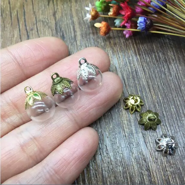 100sets 10mm round ball shape glass globe with seven flower cap jewelry findings set, vial pendant glass bottle bubble necklace
100sets 10mm round ball shape glass globe with seven flower cap jewelry findings set, vial pendant glass bottle bubble necklace