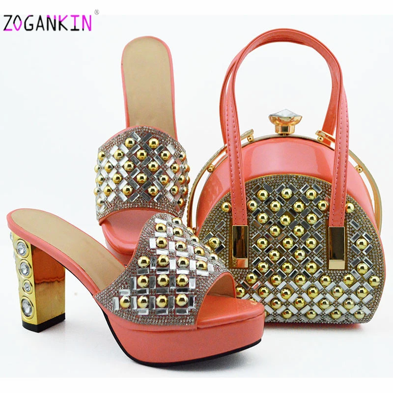 Pink Color Latest Summer Decorated With Stone Woman Shoes And Bags Set African Style High Heels Slipper And Bags For Party Dress
Pink Color Latest Summer Decorated With Stone Woman Shoes And Bags Set African Style High Heels Slipper And Bags For Party Dress
