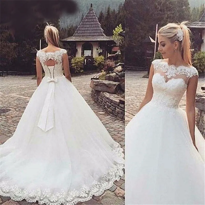 Sexy Scoop Neck Wedding Dresses 2021 Top Lace Appliques Sleeveless Cap Sleeve Bridal Gowns Sweep Train Vestido De Noiva
Sexy Scoop Neck Wedding Dresses 2021 Top Lace Appliques Sleeveless Cap Sleeve Bridal Gowns Sweep Train Vestido De Noiva