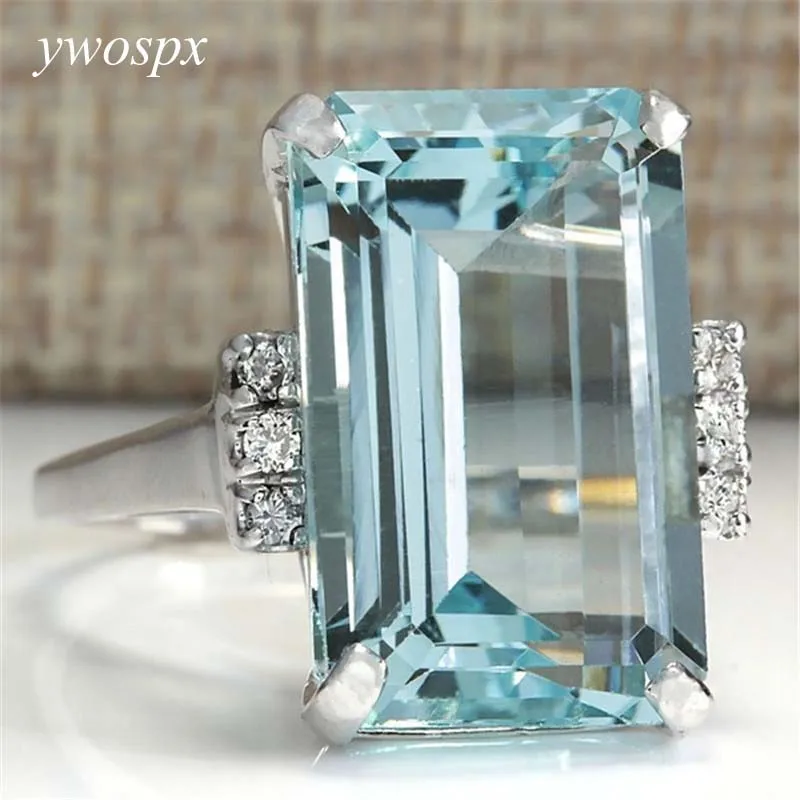 YWOSPX Big Blue CZ Cubic Zircon Stone Silver Color Rings for Women Fashion Jewelry Valentines Day Gift Wedding Love Ring Anel
YWOSPX Big Blue CZ Cubic Zircon Stone Silver Color Rings for Women Fashion Jewelry Valentines Day Gift Wedding Love Ring Anel