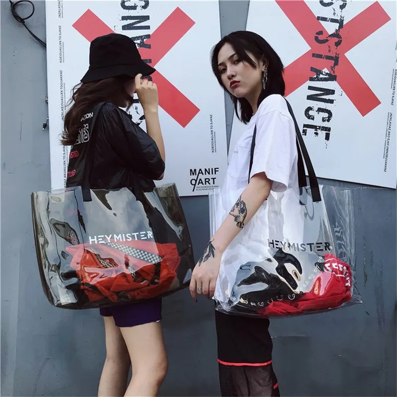 Large Capacity PVC Transparent Shoulder Bag Women Clear Jelly Big Shopping Bag High Quality Letter Print Travel Beach Bag Hot
Large Capacity PVC Transparent Shoulder Bag Women Clear Jelly Big Shopping Bag High Quality Letter Print Travel Beach Bag Hot