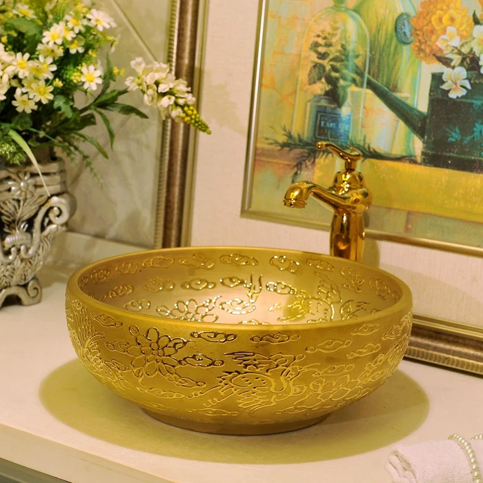 Золотистая Европейская круглая керамическая раковина Jingdezhen для ванной комнаты/художественная раковина для отелей
Золотистая Европейская круглая керамическая раковина Jingdezhen для ванной комнаты/художественная раковина для отелей