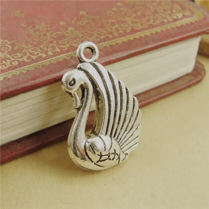 RONGQING 40pcs/lot Animal Charms 24*17*5MM Swan Pendant Metal Charms for Jewelry Making
RONGQING 40pcs/lot Animal Charms 24*17*5MM Swan Pendant Metal Charms for Jewelry Making