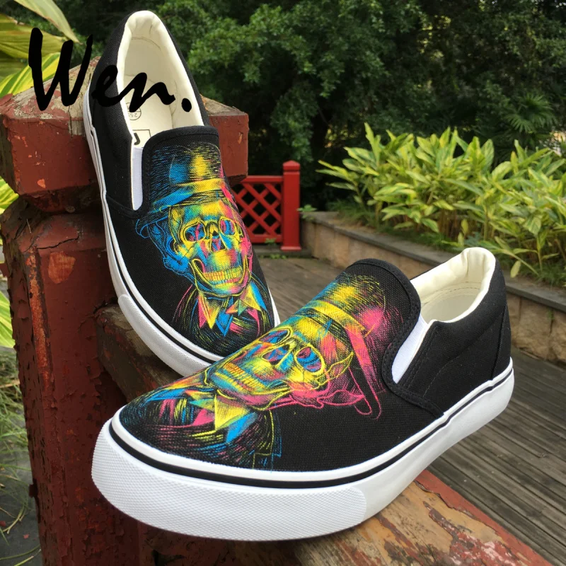 Wen Design Shoes Hand Painted Skull with Derby Hat Three-primary Colors Light and Shadow Slip On Unisex Black Canvas Sneakers
Wen Design Shoes Hand Painted Skull with Derby Hat Three-primary Colors Light and Shadow Slip On Unisex Black Canvas Sneakers