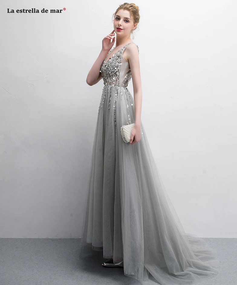 Vestido de formatura longo new tulle beaded sexy V-neck halter A line silver champagne prom dresses trailing robe de bal femme l
Vestido de formatura longo new tulle beaded sexy V-neck halter A line silver champagne prom dresses trailing robe de bal femme l