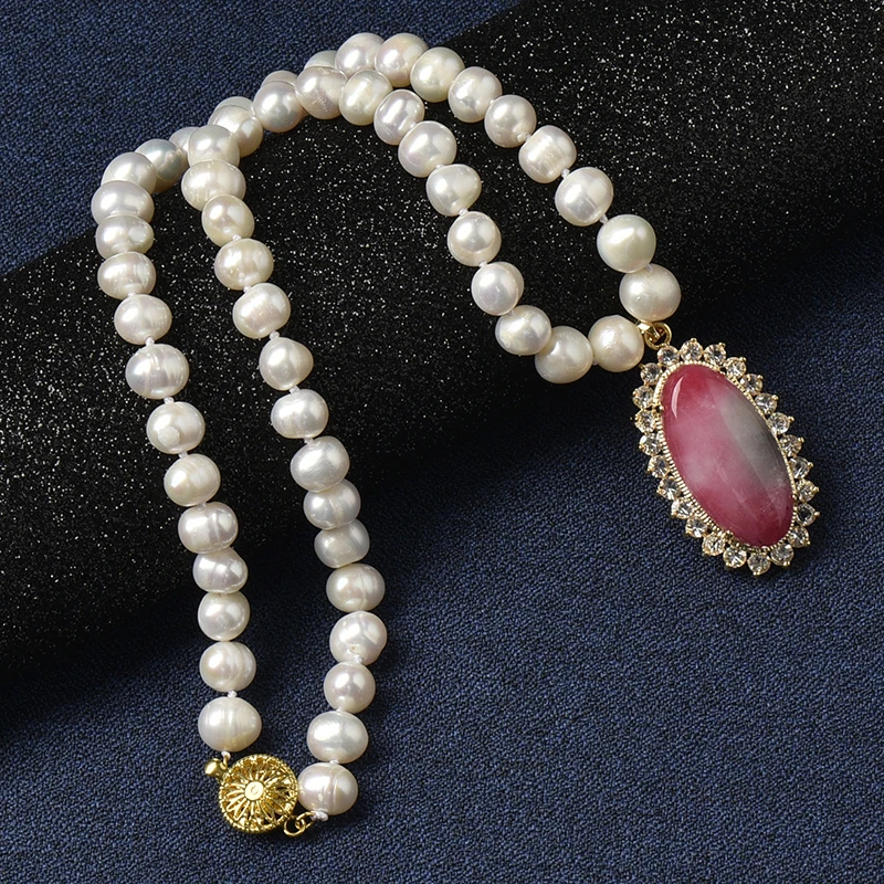 The 8-9 mm tiny Creamy pearls are matched by A light red Natural Pearl Necklace with a Light Grey Oval 24*39*10 mm pendant.
The 8-9 mm tiny Creamy pearls are matched by A light red Natural Pearl Necklace with a Light Grey Oval 24*39*10 mm pendant.