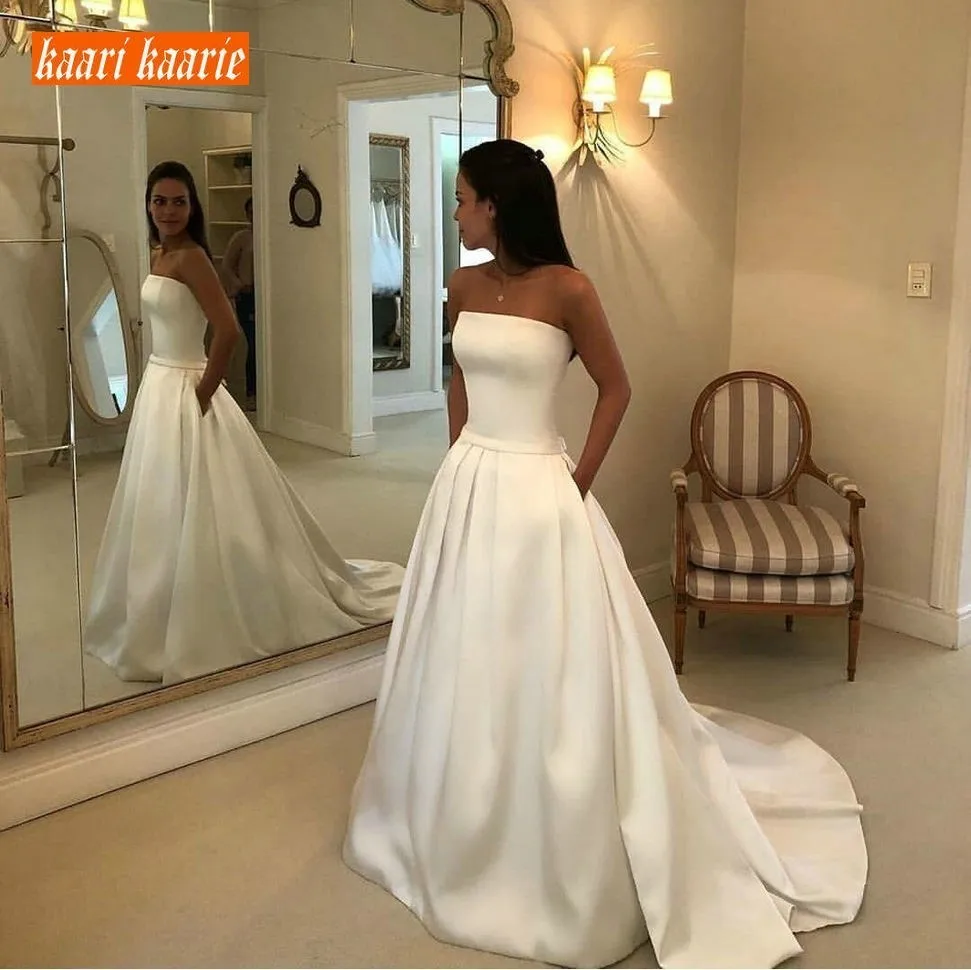 Luxury Customized Strapless Long Wedding Dress 2020 Satin Princess Wedding Gown Sleeveless Sweep Train Pockets Beach Bride Dress
Luxury Customized Strapless Long Wedding Dress 2020 Satin Princess Wedding Gown Sleeveless Sweep Train Pockets Beach Bride Dress