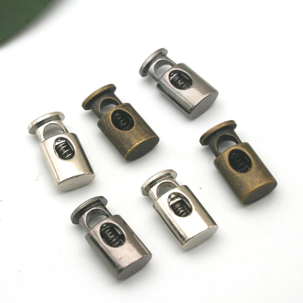 30pcs/lot oval metal alloy stoppers toggle cord locks Drawstring lock with hole silver nickle STP-004 
30pcs/lot oval metal alloy stoppers toggle cord locks Drawstring lock with hole silver nickle STP-004