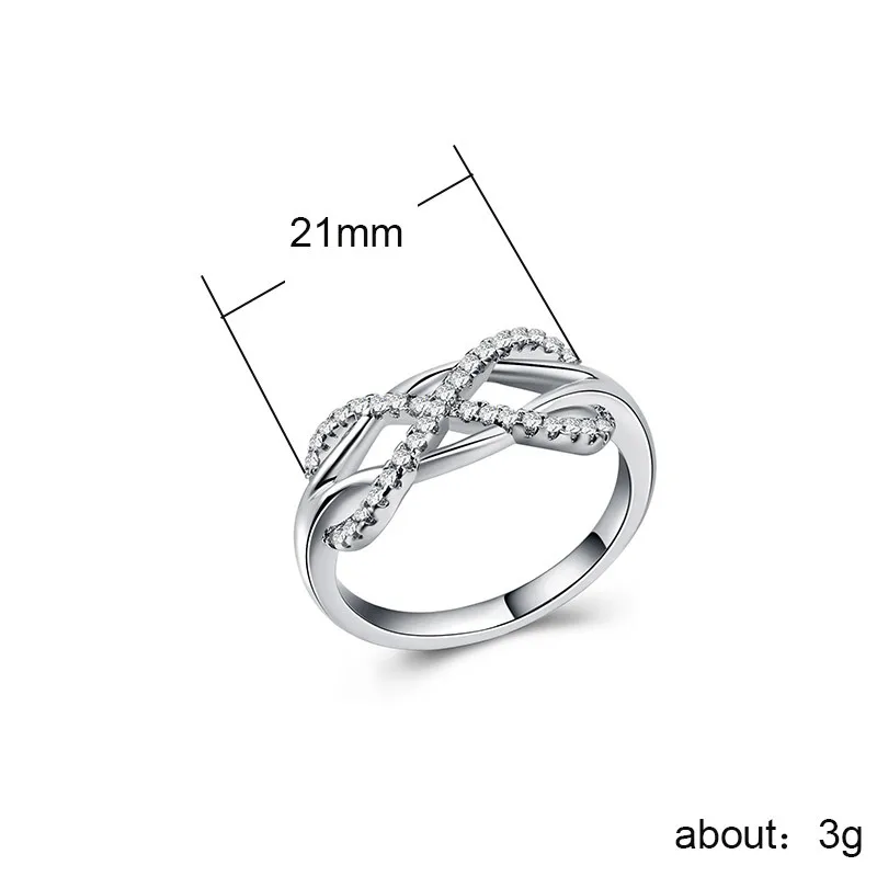 Huitan Fashion Infinity Knot Ring with Tiny Cubic Zirconia Micro Pave Korean Jewelry Engagement Wedding Rings for Women & Girls
Huitan Fashion Infinity Knot Ring with Tiny Cubic Zirconia Micro Pave Korean Jewelry Engagement Wedding Rings for Women & Girls