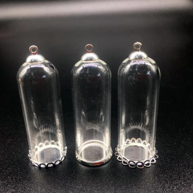 10sets/lot 50*18mm long tube Glass Dome Glass globe jars silver plated lace base beads cap set DIY glass vials pendant jewelry
10sets/lot 50*18mm long tube Glass Dome Glass globe jars silver plated lace base beads cap set DIY glass vials pendant jewelry