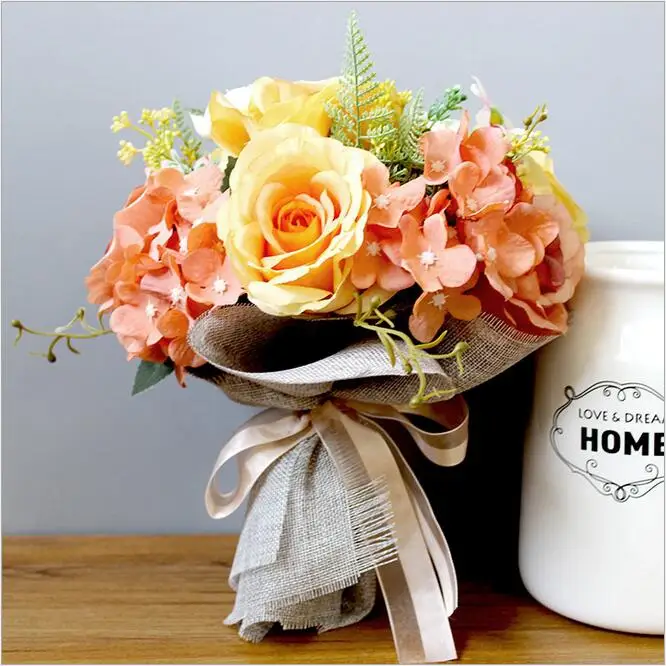 A bouquet vintage Orange flowers wedding bridal bouquet bride holding flower artificial flower bride bouquet for wedding party
A bouquet vintage Orange flowers wedding bridal bouquet bride holding flower artificial flower bride bouquet for wedding party