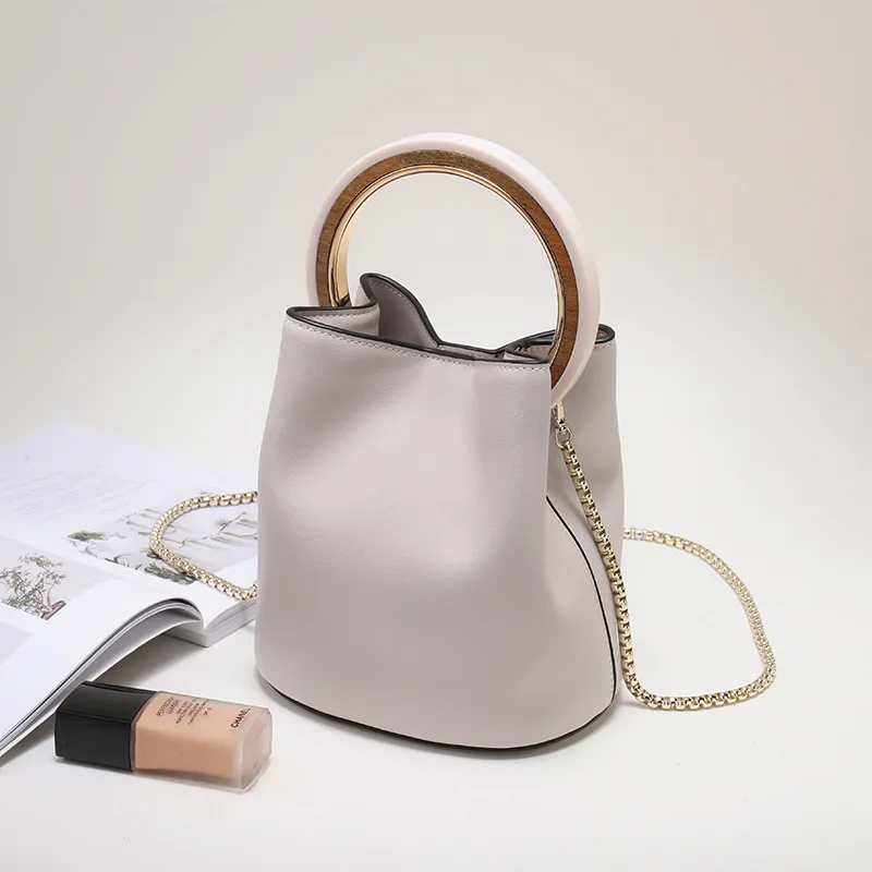 Ladies Split Leather Handbag Vintage Chains Crossbody Handbag Women Chic Ring Bucket Bag High Capacity Small Tote Bag
Ladies Split Leather Handbag Vintage Chains Crossbody Handbag Women Chic Ring Bucket Bag High Capacity Small Tote Bag