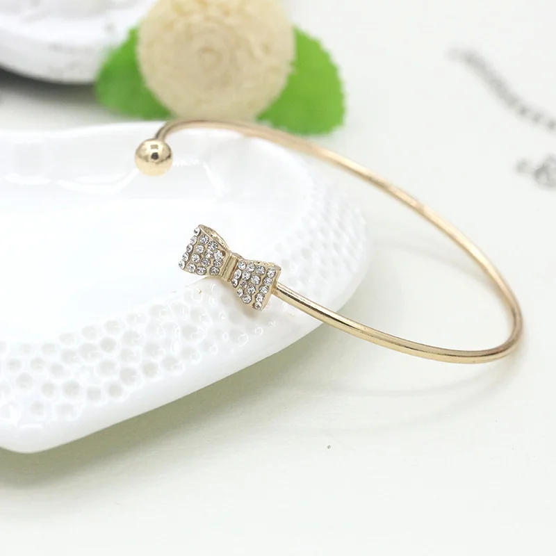 Shiny Bling Crystal Bow & Heart On Top Golden Metallic Opening Adjustable Bracelets & Bangles for Women
Shiny Bling Crystal Bow & Heart On Top Golden Metallic Opening Adjustable Bracelets & Bangles for Women