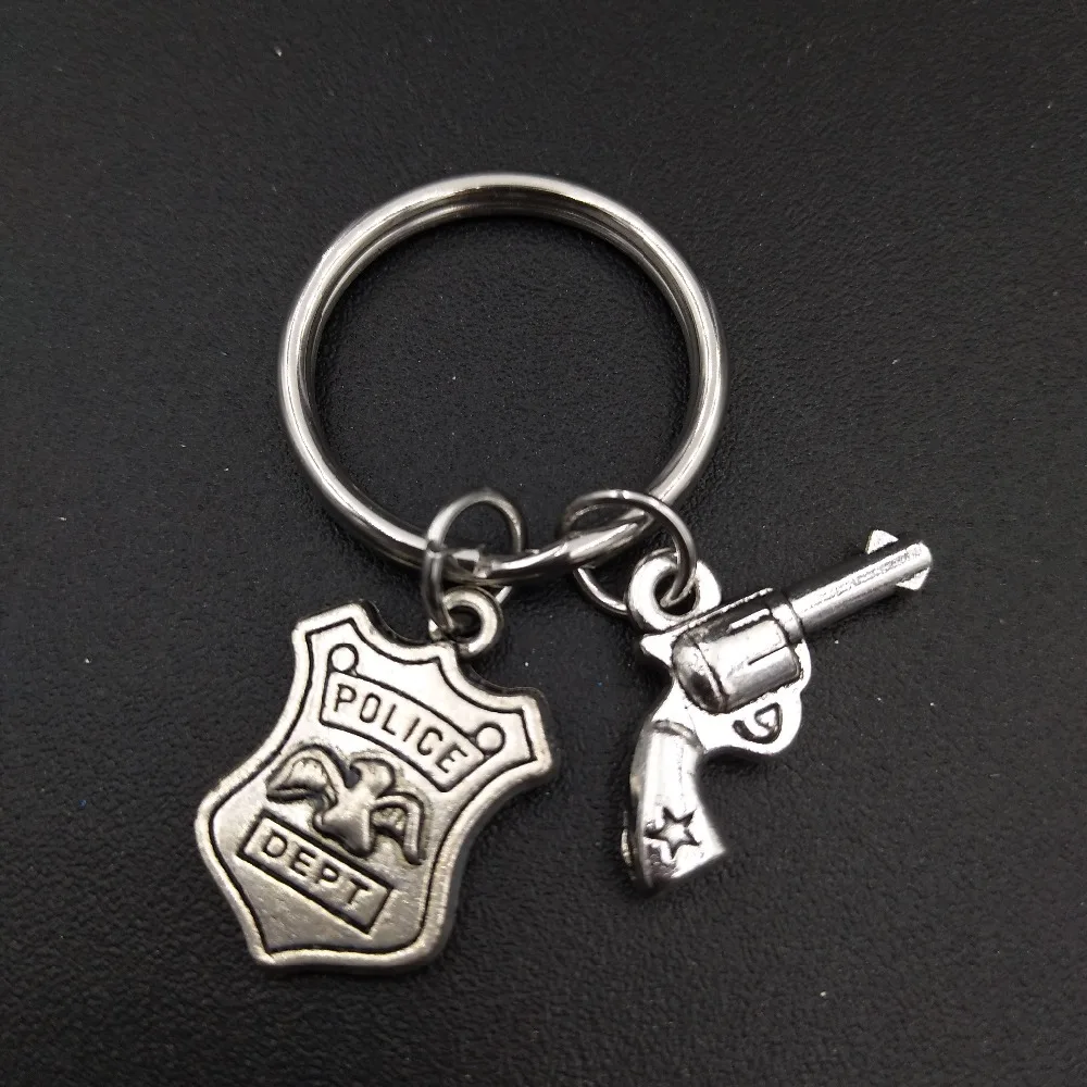 Police Dept Badge and Gun Charm Keychains Stainless Steel Keyring Fashion Unisex Jewlery Gifts for Police Mom Wife Daughter
Police Dept Badge and Gun Charm Keychains Stainless Steel Keyring Fashion Unisex Jewlery Gifts for Police Mom Wife Daughter