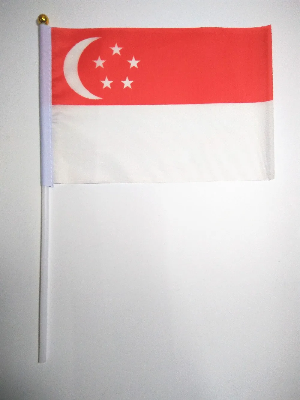 Wholesale Hand wave banners Singapore small National flags polyester materials with pole 14*21 cm
Wholesale Hand wave banners Singapore small National flags polyester materials with pole 14*21 cm