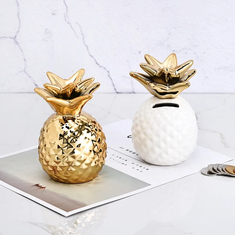 Nordic Style Golden Pineapple Piggy Bank Plating Pineapple Piggy Bank White Pineapple Storage Tank Home Decoration Ornaments 
Nordic Style Golden Pineapple Piggy Bank Plating Pineapple Piggy Bank White Pineapple Storage Tank Home Decoration Ornaments