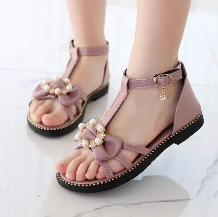 Girls Roman sandals 2019 Summer New Fashion Large Child Pear Flat Bow Buckle Princess Sandals Soft bottom Kids Beach Shoes 
Girls Roman sandals 2019 Summer New Fashion Large Child Pear Flat Bow Buckle Princess Sandals Soft bottom Kids Beach Shoes