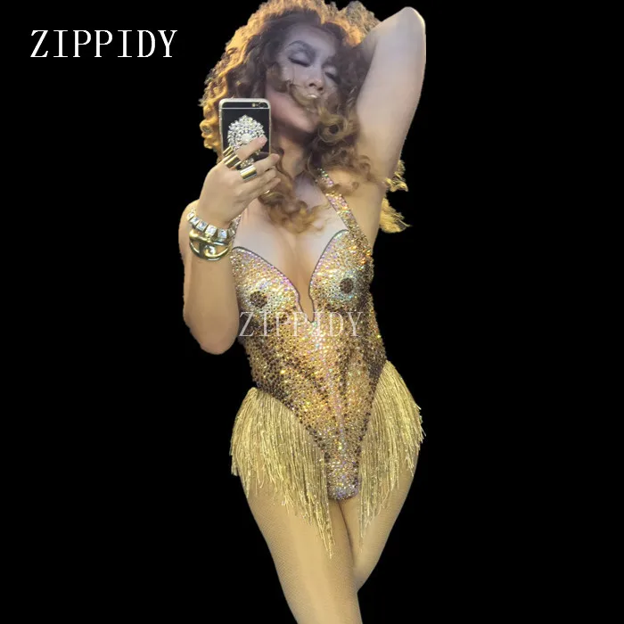Sexy Leotard Sparkly Gold Rhinestones Tassel Bodysuit Stage Wear Women's Celebrate Female Singer Crystals One Piece Costume
Sexy Leotard Sparkly Gold Rhinestones Tassel Bodysuit Stage Wear Women's Celebrate Female Singer Crystals One Piece Costume