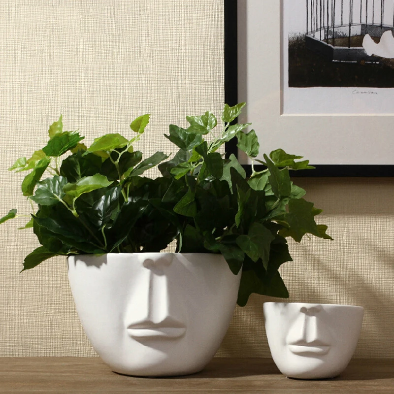 Modern creative white ceramic human face vase floral minimalist fashion home decorations furnishing abstract vase
Modern creative white ceramic human face vase floral minimalist fashion home decorations furnishing abstract vase