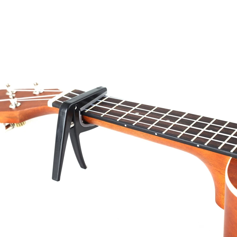 Ukulele Capo Clamp Plastic Guitar Capo Single-handed Quick Change Acoustic And Electric 4 String Guitars Ukulele Accessories
Ukulele Capo Clamp Plastic Guitar Capo Single-handed Quick Change Acoustic And Electric 4 String Guitars Ukulele Accessories