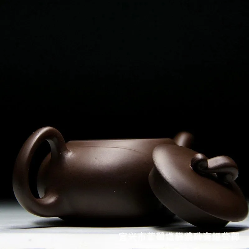 Manufacturers wholesale Yixing teapot original ore purple mud charm ball hole teapot 220 ml
Manufacturers wholesale Yixing teapot original ore purple mud charm ball hole teapot 220 ml