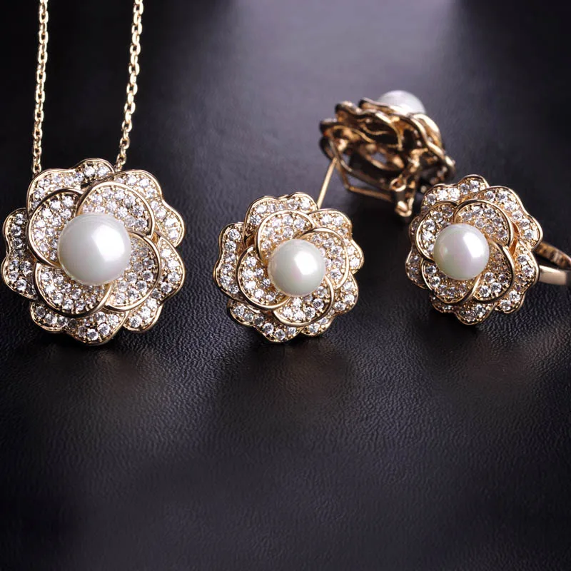 Blucome Cubic Zircon Imitation Pearl Flower Jewelry Sets Gold Color Wedding Women Lady Bijoux Copper Earrings Necklace Ring Set
Blucome Cubic Zircon Imitation Pearl Flower Jewelry Sets Gold Color Wedding Women Lady Bijoux Copper Earrings Necklace Ring Set