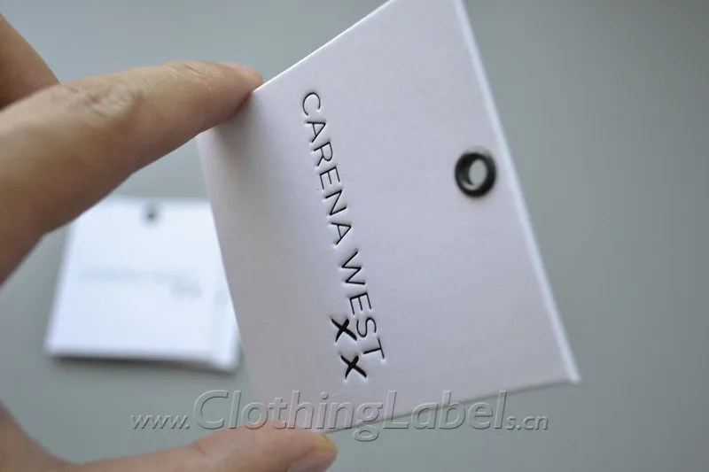 Custom hang tags printed paper hang tags, white cardboard paper, black engraved logo, 2mm thick, with metal eyelet
Custom hang tags printed paper hang tags, white cardboard paper, black engraved logo, 2mm thick, with metal eyelet