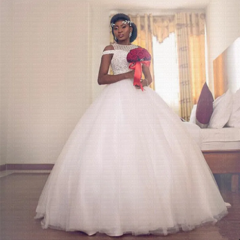 Amazing Beading African Wedding Dress 2019 Unique Neck Design Ball Gown Bridal Gowns
Amazing Beading African Wedding Dress 2019 Unique Neck Design Ball Gown Bridal Gowns
