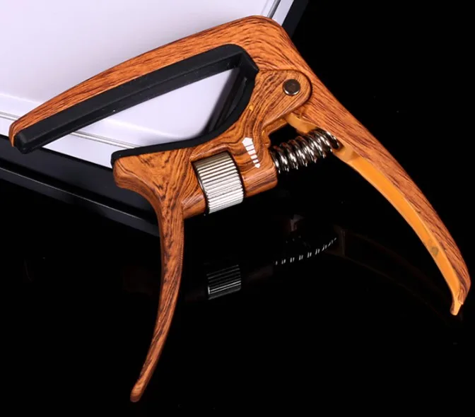 Aroma AC-30 Guitar Capo with Adjustable Pressure Tension and Built-in Bridge Pin Puller
Aroma AC-30 Guitar Capo with Adjustable Pressure Tension and Built-in Bridge Pin Puller