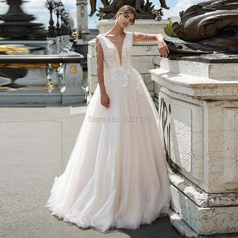 2021 Elegant Tulle A Line Wedding Dresses Lace Appliques Beading Sleeveless Deep V Neck Vestido De Noiva Lace Up Bridal Gowns
2021 Elegant Tulle A Line Wedding Dresses Lace Appliques Beading Sleeveless Deep V Neck Vestido De Noiva Lace Up Bridal Gowns