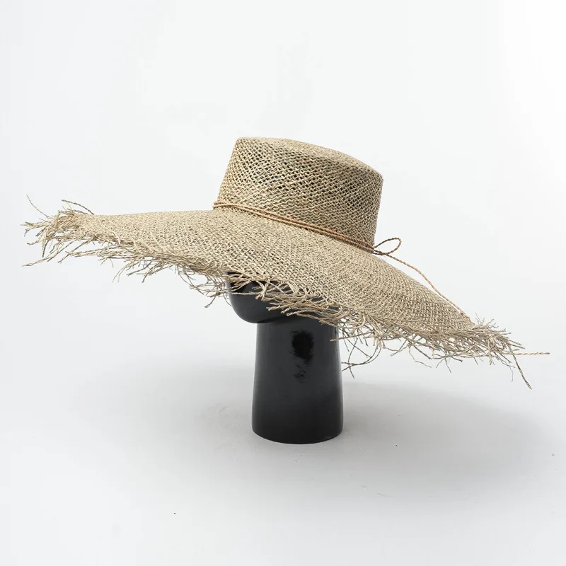 New hand-woven large-edged flat-topped seagrass straw hat in spring and summer Europe and America beach hat sun hat adjustable
New hand-woven large-edged flat-topped seagrass straw hat in spring and summer Europe and America beach hat sun hat adjustable