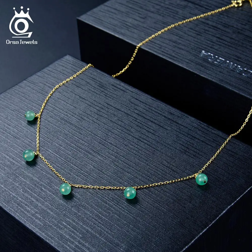 ORSA JEWELS ожерелье-чокер из стерлингового серебра 925 пробы для женщин с натуральным зеленым камнем авантюрин Бусины золотого цвета цепочка Юве...
ORSA JEWELS ожерелье-чокер из стерлингового серебра 925 пробы для женщин с натуральным зеленым камнем авантюрин Бусины золотого цвета цепочка Юве...
