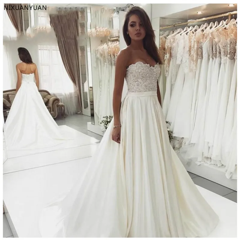 Элегантное свадебное платье Vestidos De Novia 2021 белого цвета и цвета слоновой кости, трапециевидной формы сатиновое свадебное платье сексуальное ...
Элегантное свадебное платье Vestidos De Novia 2021 белого цвета и цвета слоновой кости, трапециевидной формы сатиновое свадебное платье сексуальное ...