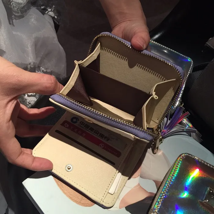 New Women Hologram bag wallet Small clutch handbag with Tassel female laser silver bag coin purse bag Shinning
New Women Hologram bag wallet Small clutch handbag with Tassel female laser silver bag coin purse bag Shinning