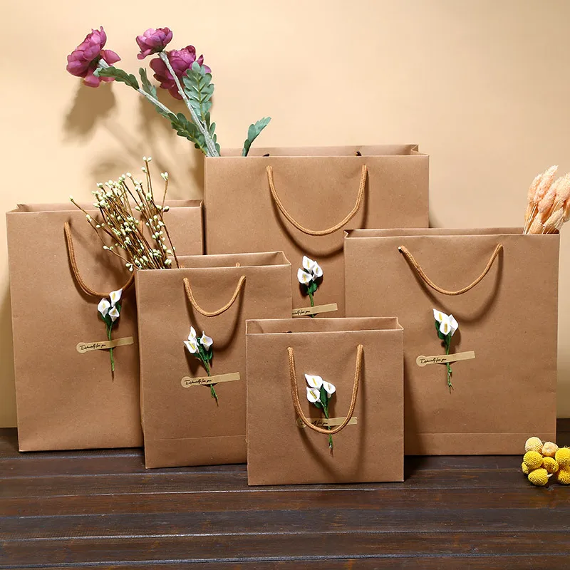 12Pcs Kraft paper bag Luxury Party Bags with Flower Decoration Kraft Paper Gift Bag With Handles Recyclable Loot Bag
12Pcs Kraft paper bag Luxury Party Bags with Flower Decoration Kraft Paper Gift Bag With Handles Recyclable Loot Bag