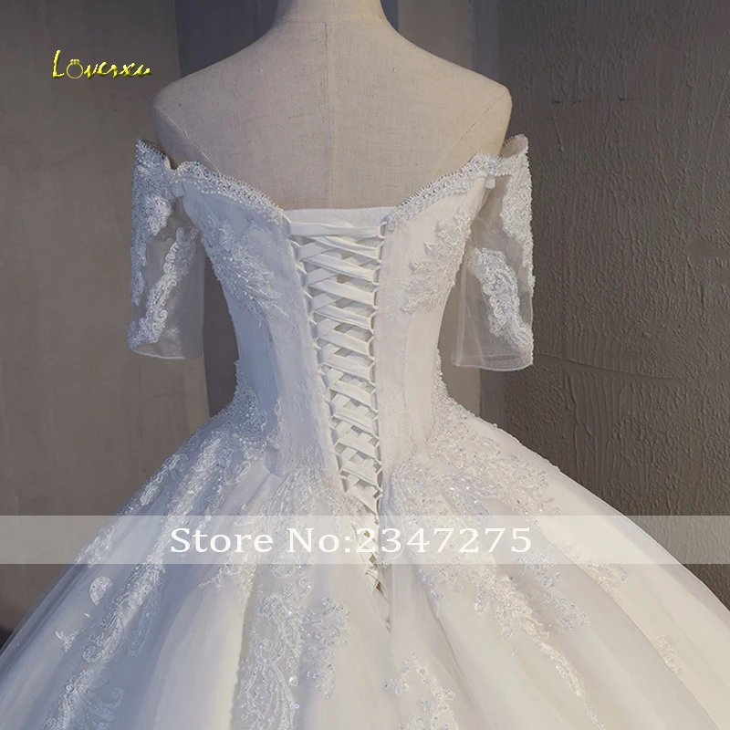 Loverxu Sexy Boat Neck Appliques Half Sleeve A-Line Wedding Dress 2019 Delicate Beaded Chapel Train Bridal Gown Vestido de Noiva
Loverxu Sexy Boat Neck Appliques Half Sleeve A-Line Wedding Dress 2019 Delicate Beaded Chapel Train Bridal Gown Vestido de Noiva