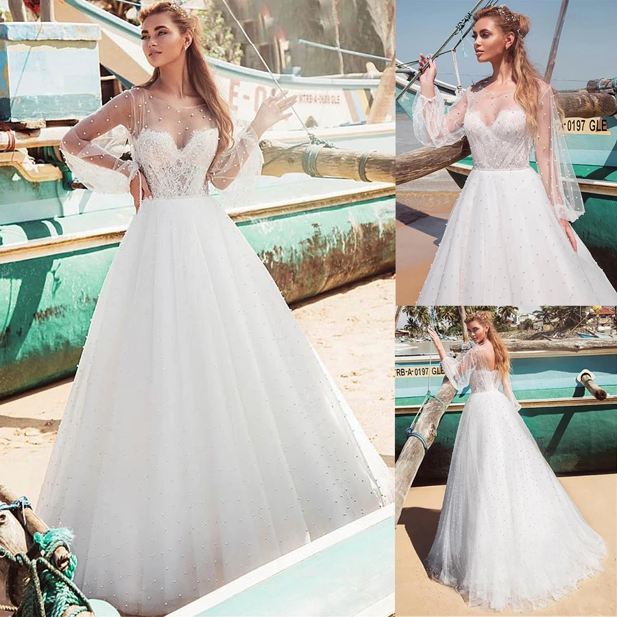 Великолепное Тюлевое свадебное платье-трапеция с вырезом лодочкой, искусственный жемчуг Длинные рукава Свадебные платья с жемчугом
Великолепное Тюлевое свадебное платье-трапеция с вырезом лодочкой, искусственный жемчуг Длинные рукава Свадебные платья с жемчугом