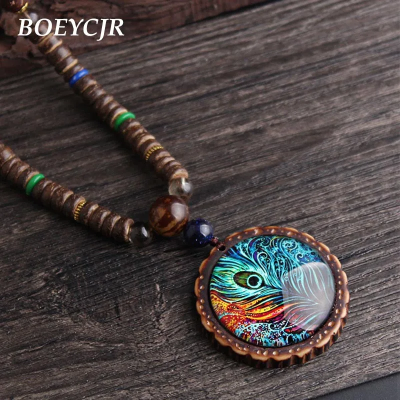 Деревянные бусины BOEYCJR, перо павлина, узор, Винтажные Ювелирные изделия ручной работы, длинное ожерелье с подвеской для женщин
Деревянные бусины BOEYCJR, перо павлина, узор, Винтажные Ювелирные изделия ручной работы, длинное ожерелье с подвеской для женщин
