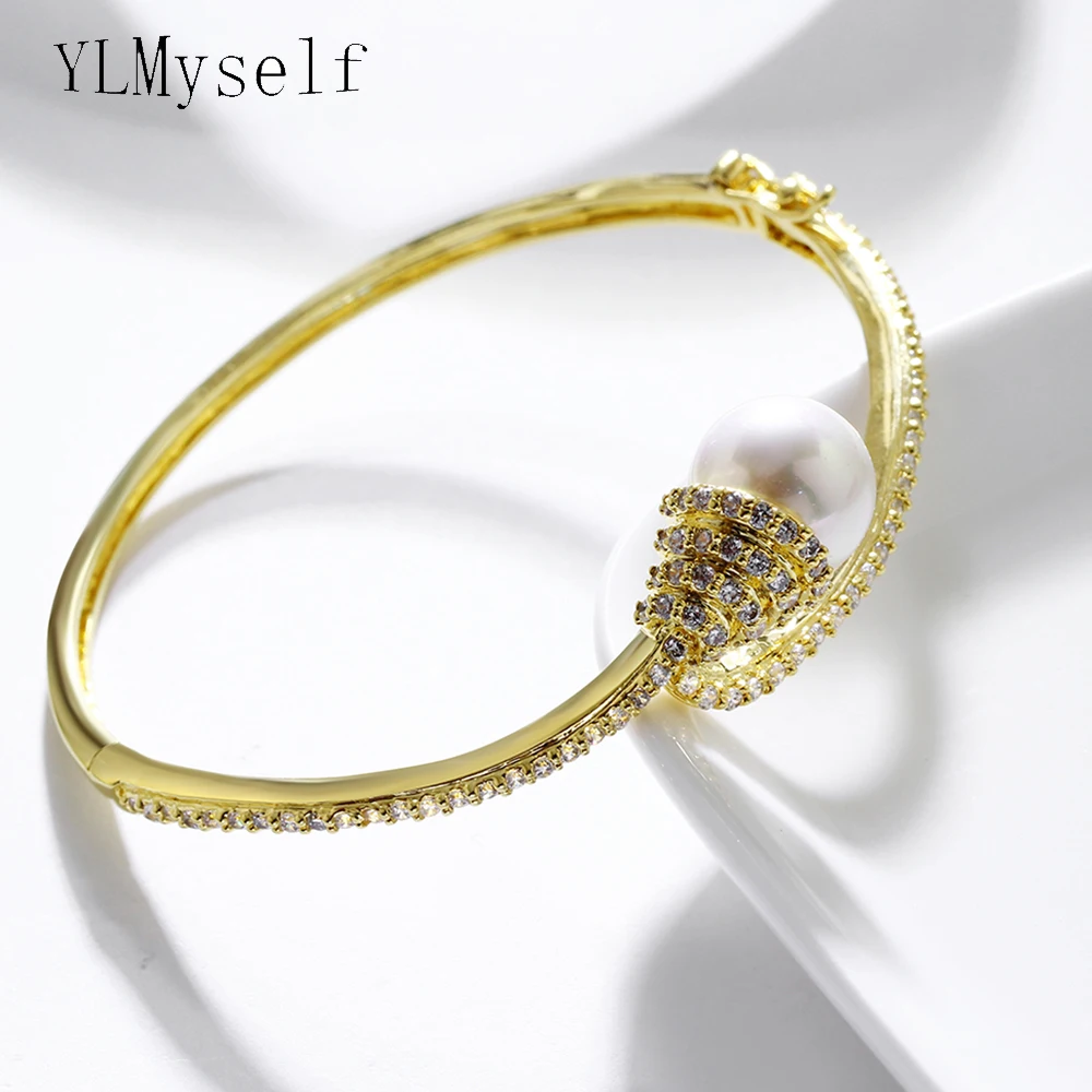 New pearl Bangle white and gold plate jewelry fast delivery stable quality aaa crystal elegant Bracelet for women
New pearl Bangle white and gold plate jewelry fast delivery stable quality aaa crystal elegant Bracelet for women