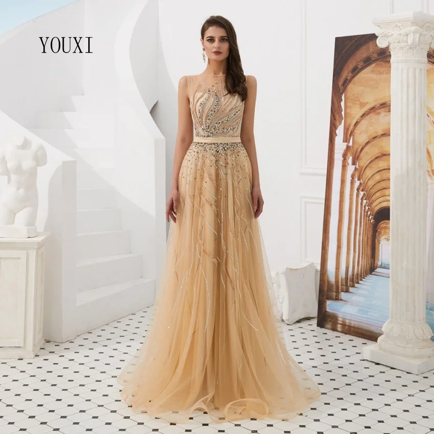 Sexy Gold Illusion Beaded Crystal Prom Dresses New Robe de Soiree Evening Party Gown Custom Made Abendkleider
Sexy Gold Illusion Beaded Crystal Prom Dresses New Robe de Soiree Evening Party Gown Custom Made Abendkleider