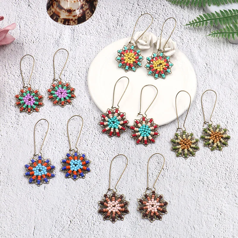 European and American new style rice pearl fringed Earrings fashionable personality lady sunflower handmade jewelry earrings
European and American new style rice pearl fringed Earrings fashionable personality lady sunflower handmade jewelry earrings
