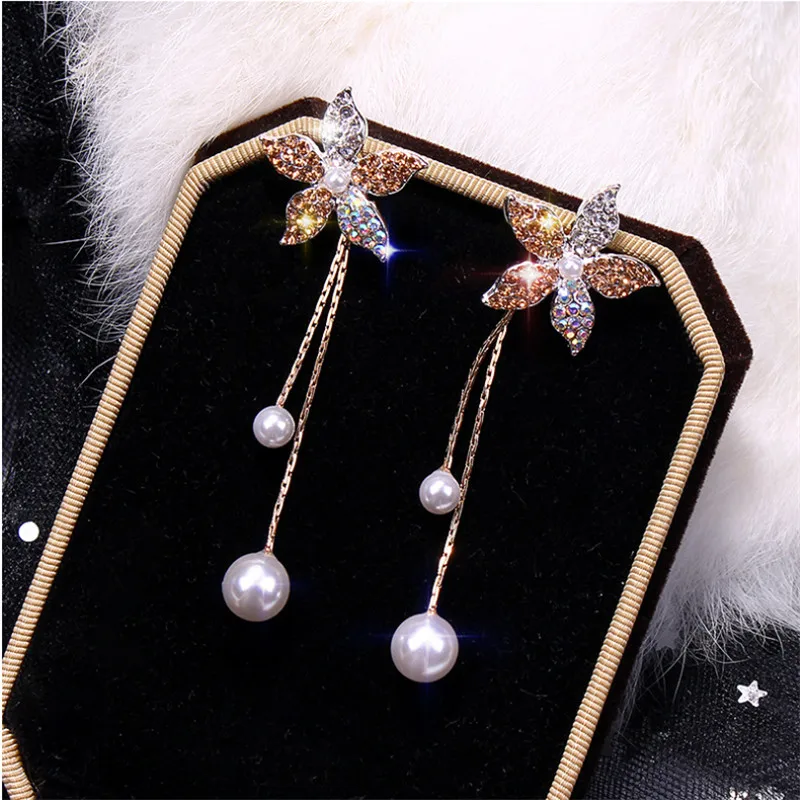 Woman pearl needle flower shiny earrings female Korean temperament long earrings personality wild female earrings ear jewelry
Woman pearl needle flower shiny earrings female Korean temperament long earrings personality wild female earrings ear jewelry