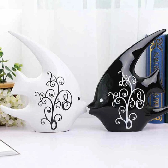 A black and white couple ceramic kissing fish modern home decoration of wedding gifts
A black and white couple ceramic kissing fish modern home decoration of wedding gifts