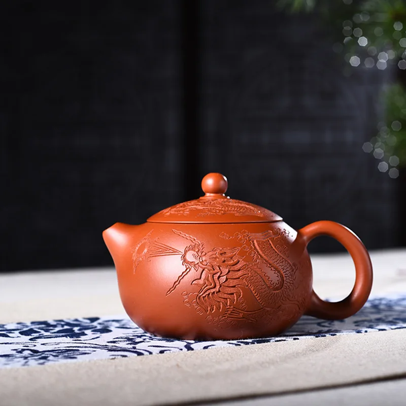 Yixing purple clay pot genuine famous artisans all hand-made raw ore Zhuni Xishi pot carved dragon Kungfu Teapot Tea Set
Yixing purple clay pot genuine famous artisans all hand-made raw ore Zhuni Xishi pot carved dragon Kungfu Teapot Tea Set