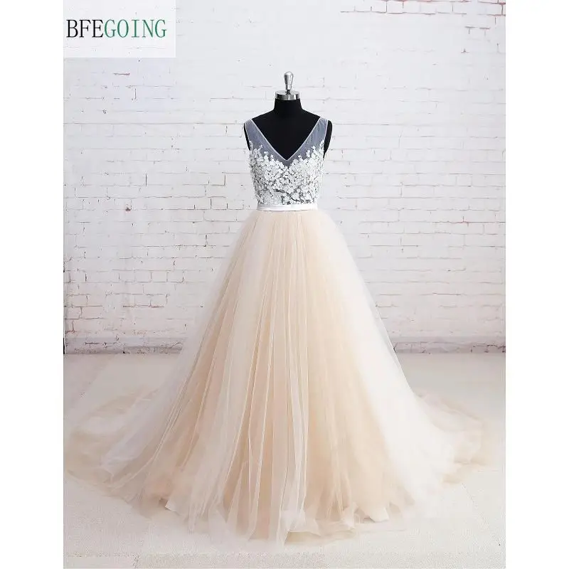 Champagne Tulle V-Neck A-Line Wedding Dress Floor-Length Chapel Train Appliques Real/Original Picture Custom Made
Champagne Tulle V-Neck A-Line Wedding Dress Floor-Length Chapel Train Appliques Real/Original Picture Custom Made