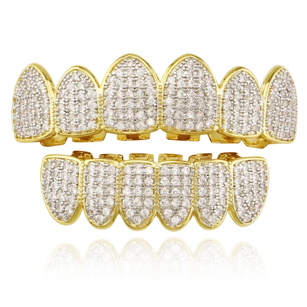 Iced Out Grillz TEETH Men Women Vampire gold color Hip Hop AAA Zircon Fang Mouth Teeth Caps Top & Bottom Dental Grills Set
Iced Out Grillz TEETH Men Women Vampire gold color Hip Hop AAA Zircon Fang Mouth Teeth Caps Top & Bottom Dental Grills Set