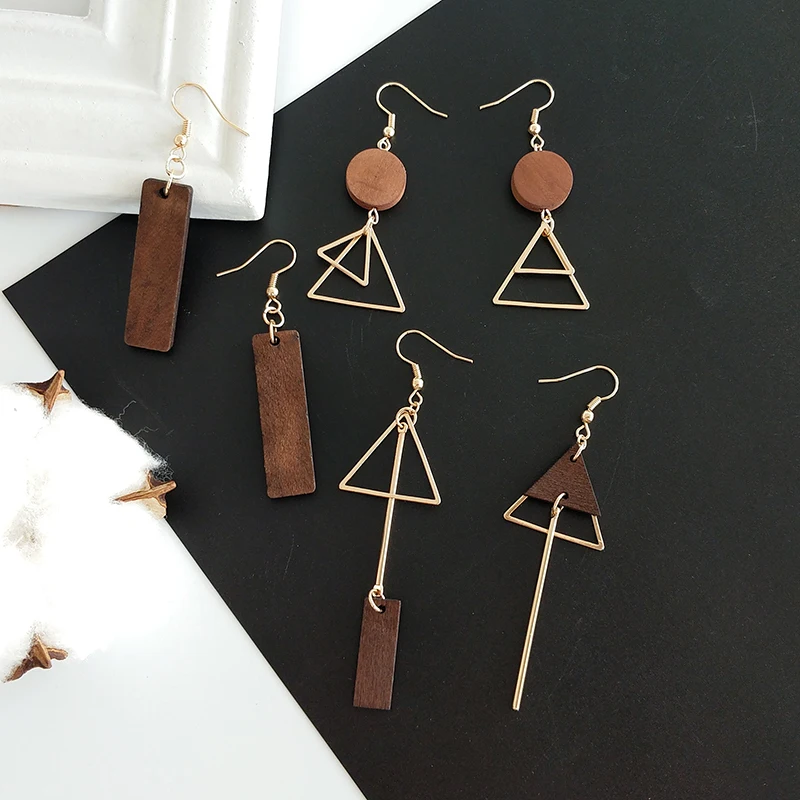 Original hand made ornaments simple geometric wooden triangle asymmetric earrings stud female ear clip Fashionable lady earrings
Original hand made ornaments simple geometric wooden triangle asymmetric earrings stud female ear clip Fashionable lady earrings